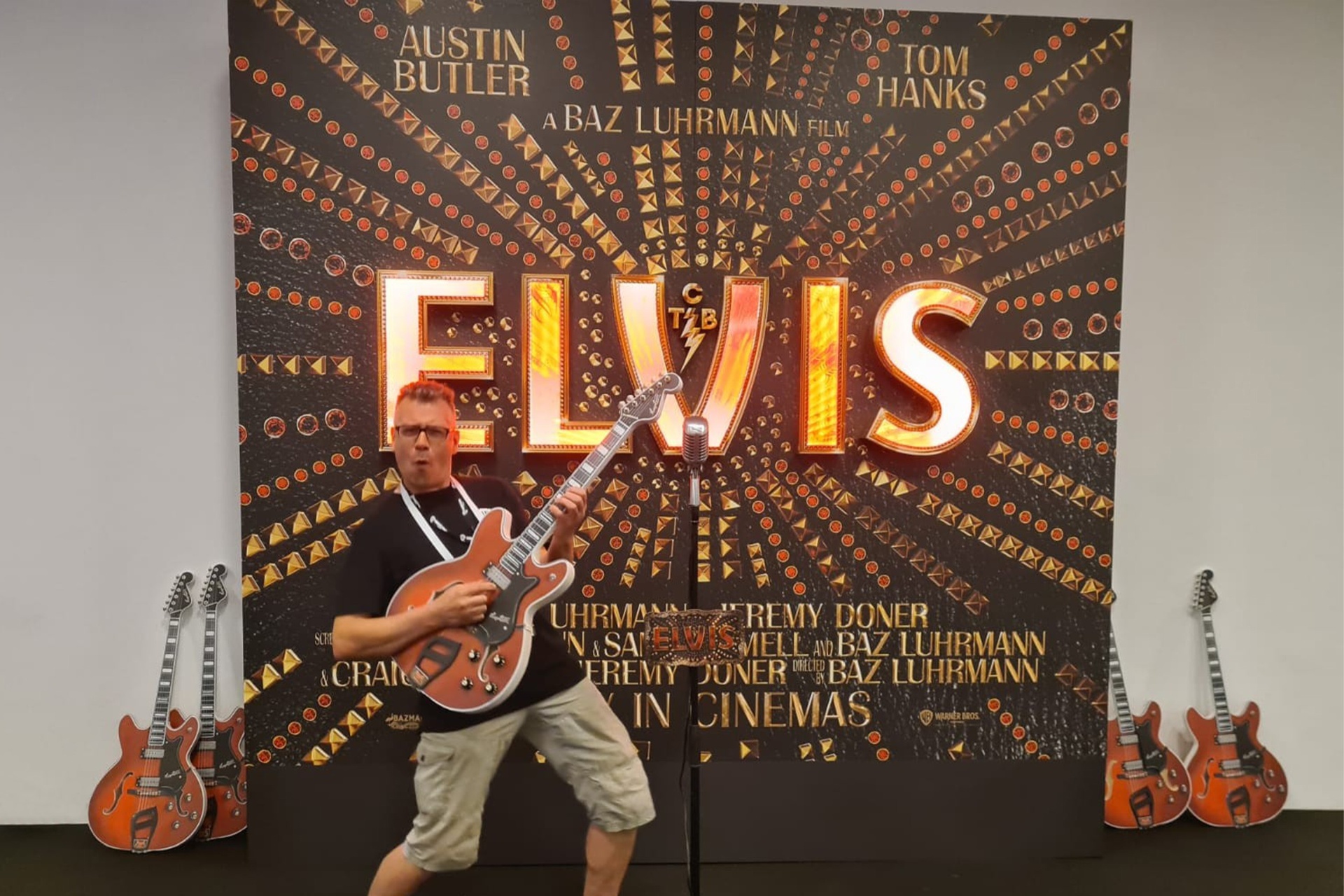 Elvis cinema display with illuminated letters and guitar props